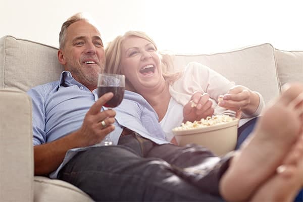 Couple watching television from couch