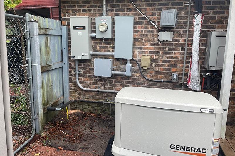 Generac Guardian Series 24kW air-cooled generator, model 7210 installed behind a fence